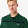 Herren-Tennis-Heritage-Poloshirt mit Ultra Dry-Emblem Herren-Tennis-Heritage-Poloshirt mit Ultra Dry-Emblem