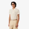 Klassisch geschnittenes gestreiftes Petit Piqué-Poloshirt Klassisch geschnittenes gestreiftes Petit Piqué-Poloshirt
