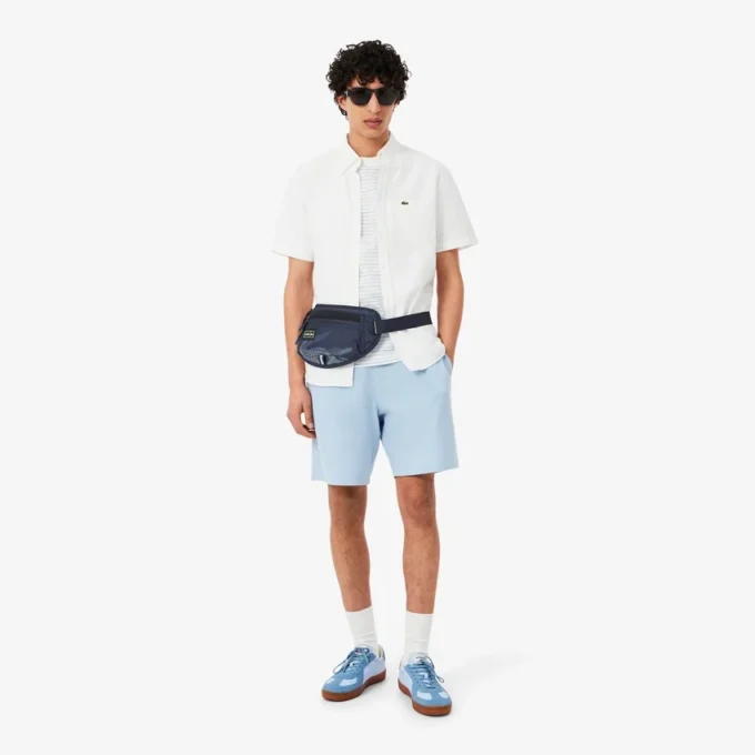 Play in Lacoste-Gürtel-Tasche