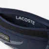 Play in Lacoste-Gürtel-Tasche