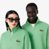 Unisex-Sweatshirt mit halbem Reißverschluss, lockerer Passform und Emblem-Akzent